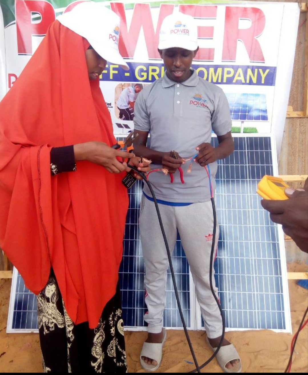 Gender inclusive in renewable enegry-Naima with Power OffGrid the first Somali female supervising 300 W solar panel wire connection she designed for Solar home system in Mogadishu.